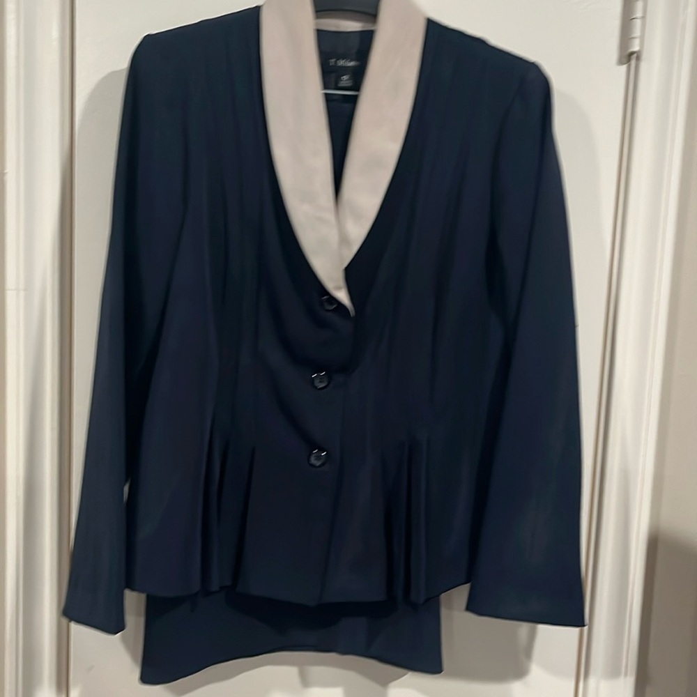 Woman’s skirt suit with jacket. Navy blue